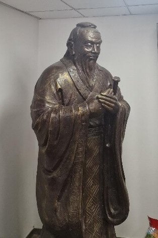 A statue of Confucius, Chinese philosopher and teacher, displayed in the DHH Law firm’s office.